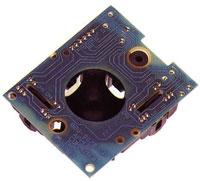 The bottom of the mouse. The two rollers within the tracking-ball shell rotate when the mouse (tracking ball) moves, sending signals down two channels that monitor mouse movement