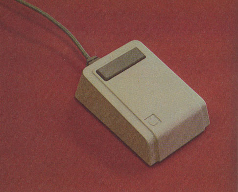 Photo 3: The “mouse” pointing device is about the size of a package of cigarettes and has one button on top.