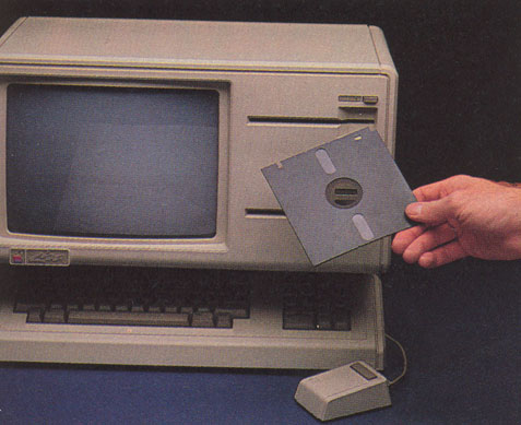 The Lisa floppy-disk drive, along with the special floppy disks it uses.