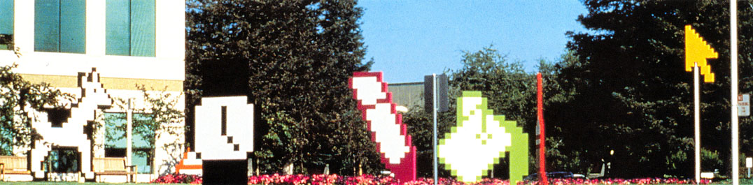 “Giant Macintosh icons sport in the sculpture garden, a public art installation that brings the familiar pictograms to life”