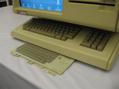 Lisa keyboard with reference cards shown.